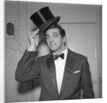 Frankie Vaughan posing with a hat by Harry Hammond