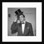 Frankie Vaughan posing with a hat by Harry Hammond