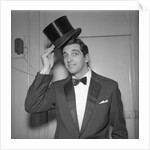 Frankie Vaughan posing with a hat by Harry Hammond