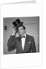 Frankie Vaughan posing with a hat by Harry Hammond