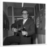 Peter Sellers holding a guitar by Harry Hammond