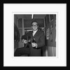 Peter Sellers holding a guitar by Harry Hammond