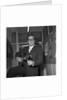 Peter Sellers holding a guitar by Harry Hammond