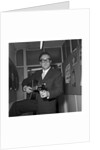 Peter Sellers holding a guitar by Harry Hammond