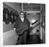 Peter Sellers holding a guitar by Harry Hammond