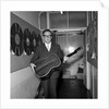 Peter Sellers holding a guitar by Harry Hammond