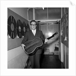 Peter Sellers holding a guitar by Harry Hammond