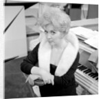 Marion Ryan, 1950s British pop singer, seated by a piano by Harry Hammond