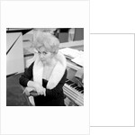 Marion Ryan, 1950s British pop singer, seated by a piano by Harry Hammond