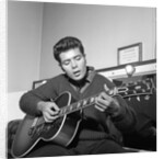 Cliff Richard playing his guitar by Harry Hammond