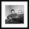 Cliff Richard playing his guitar by Harry Hammond