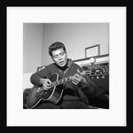 Cliff Richard playing his guitar by Harry Hammond