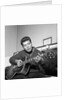 Cliff Richard playing his guitar by Harry Hammond