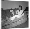Cliff Richard on a sofa with soft toys by Harry Hammond