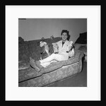 Cliff Richard on a sofa with soft toys by Harry Hammond