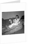 Cliff Richard on a sofa with soft toys by Harry Hammond