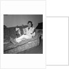 Cliff Richard on a sofa with soft toys by Harry Hammond
