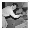 Cliff Richard playing records by Harry Hammond