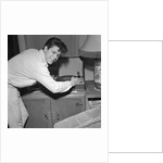 Cliff Richard playing records by Harry Hammond