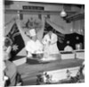 Cliff Richard baking at J.Lyons in Cadby Hall, Hammersmith by Harry Hammond
