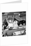 Cliff Richard baking at J.Lyons in Cadby Hall, Hammersmith by Harry Hammond