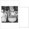 Cliff Richard mixing a giant Christmas pudding at J.Lyons in Cadby Hall, Hammersmith by Harry Hammond