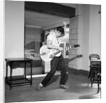 Cliff Richard playing the guitar by Harry Hammond