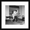 Cliff Richard playing the guitar by Harry Hammond