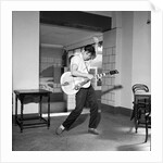 Cliff Richard playing the guitar by Harry Hammond