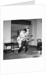 Cliff Richard playing the guitar by Harry Hammond