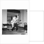 Cliff Richard playing the guitar by Harry Hammond