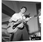 Cliff Richard playing the guitar by Harry Hammond