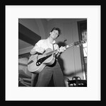 Cliff Richard playing the guitar by Harry Hammond