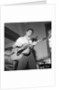 Cliff Richard playing the guitar by Harry Hammond