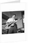 Cliff Richard playing the guitar by Harry Hammond