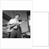 Cliff Richard playing the guitar by Harry Hammond