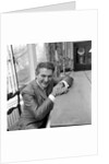 Liberace seated at the piano at the Savoy Hotel by Harry Hammond