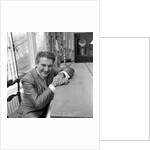 Liberace seated at the piano at the Savoy Hotel by Harry Hammond