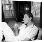 Jerry Lewis relaxing with a cigarette by Harry Hammond