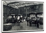 Loading up new matresses for delivery in the yard of Torrington Place by Unknown