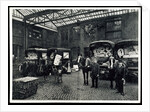 Loading up new matresses for delivery in the yard of Torrington Place by Unknown