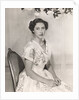 Princess Margaret sitting on a chair by Cecil Beaton