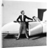 Model beside open door of Austin of England A90 Atlantic Sports saloon convertible by Elsbeth Juda