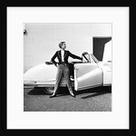 Model beside open door of Austin of England A90 Atlantic Sports saloon convertible by Elsbeth Juda