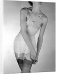 Model wearing girdle with suspender belt by John French