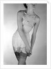 Model wearing girdle with suspender belt by John French