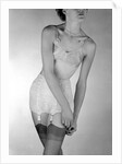 Model wearing girdle with suspender belt by John French
