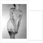 Model wearing girdle with suspender belt by John French