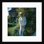 Sir Cecil Beaton in the garden of his home by Anthony Crickmay