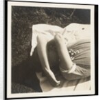 Woman wearing striped t-shirt lying on rug with both arms covering face by Curtis Moffat